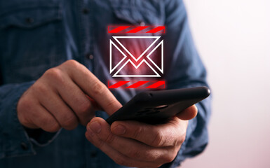 Crop man using smartphone with new email alert icon