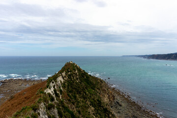 Obraz premium View from the La Regalina viewpoint. In the foreground you can see the Tip of the Horn and in the background the sea and the coast. Cadavedo, Asturias.