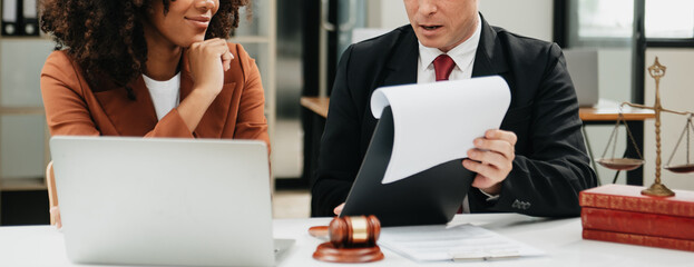 Business and lawyers discussing contract papers with brass scale on desk in office. Law, legal...