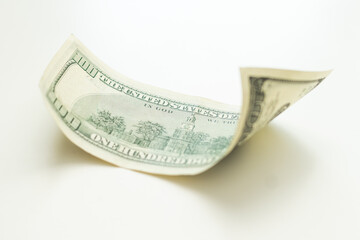 flying hundred dollar banknote isolated on white