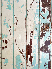 Old rusty background.Vintage horizontal shabby planks in blue white and brown.Peel painted scratches wooden texture background.