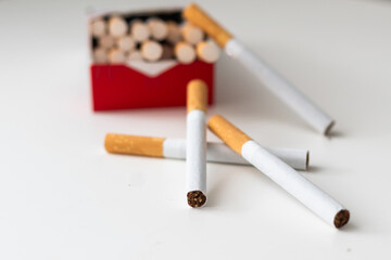 Cigarettes with a yellow filter. Macro shooting