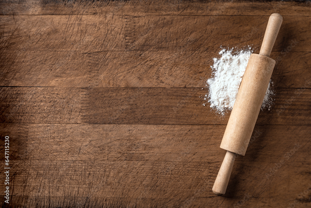 Wall mural rolling pin and flour on wooden board