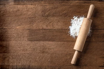 Fotobehang Rolling pin and flour on wooden board © mizina