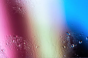 Water drops on a glass surface close up