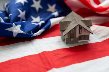 House with American flag. American Real Estate concept. United States Housing Market Concepts. 