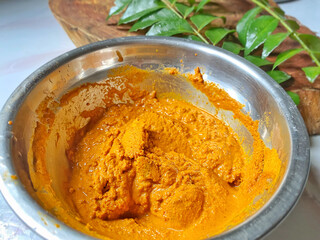 Local hot curry paste. Moist with water added some turmeric and white pepper powder.