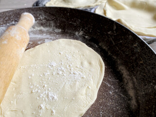 Flatten dough background. For flatbreads making.