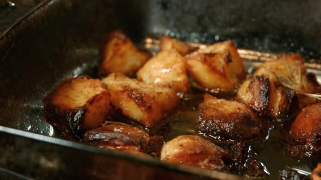 Crispy Roast Potatoes in Bubbling Oil Fresh Out the Oven