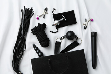A collection of sex toys on a light background.