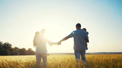 happy family in park wheat field. friendly family walks in a wheat field with two children baby toddlers in summer. happy family kid dream concept. big family silhouette sunset in wheat field