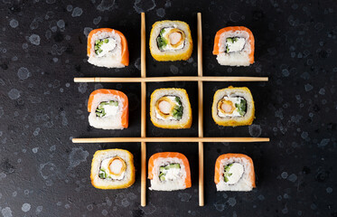 Sushi and rolls cooked on the table