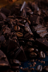 Pieces of chocolate and spices on the table
