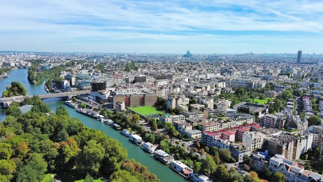 Paris: Aerial view of capital city of France, river island Puteaux (l'İle de Puteaux) on Seine, sunny day with clear blue sky - landscape panorama of Europe from above