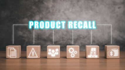 Product recall concept, Wooden block on desk with product recall icon on virtual screen.