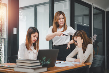 Serious business team leader coach mentor talk to diverse business people in office explain strategy at corporate group meeting, multiethnic staff listen to boss instruct interns at briefing