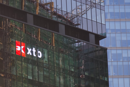 XTB company logo, signage, emblem on the skyscraper facade. XTB is a trading platform, online broker, global leader in FX and CFD trading. Warsaw, Poland - September 10, 2023