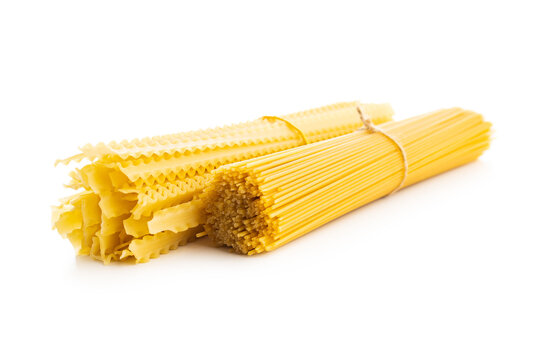 Spaghetti and mafaldine pasta. Uncooked italian pasta isolated on white background.