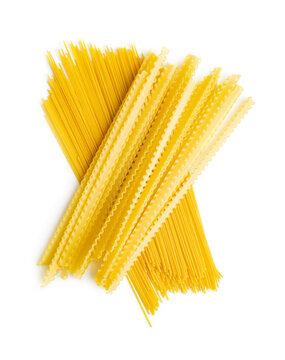 Uncooked mafaldine and spaghetti pasta. Raw long mafalda pasta isolated on white background.
