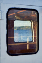A vintage boat window of Lake Mjosa.