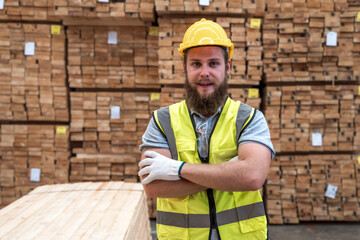 Wood factory worker man in safety uniform in  wood distribution warehouse