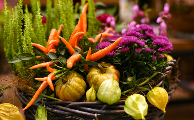 Autumn composition of flowers and peppers