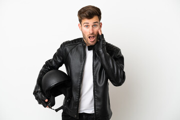 Young caucasian man with a motorcycle helmet isolated on white background with surprise and shocked facial expression