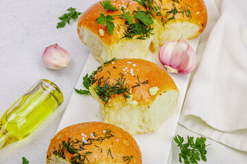 Aromatic garlic buns. Fresh baked goods, a traditional gluten-free soup snack. Parsley, spices