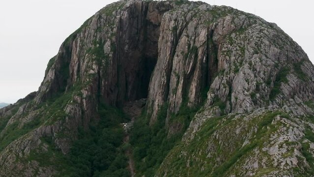 Drone reveal dark mystical hole cave through Torghatten mountain