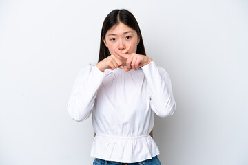 Young Chinese woman isolated on white background showing a sign of silence gesture