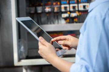 Electrician Engineer using  software check service maintenance electricity main circuit fuse and power system in industry factory