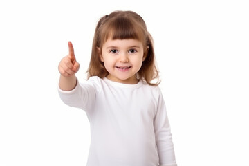 A little girl on a white background gesticulates with her index finger, copy space