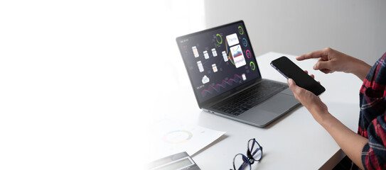 Asian businesswoman in formal suit in office happy and cheerful during using smartphone and working, copy space.