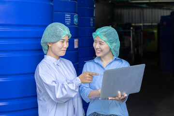 Water quality control officer engineer team inspect water tanks in beverage industry factory for...