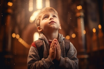 Cute small African American boy praying in the church and Jesus giving blessing - obrazy, fototapety, plakaty
