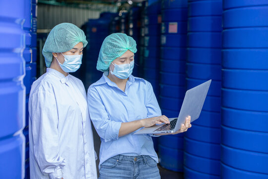 Water quality control officer engineer team inspect water tanks in beverage industry factory for ensure cleanliness standards.