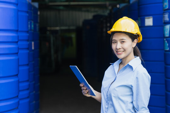 Portrait happy water quality control officer inspector testing water tanks food industry factory for clean and healthy products standards.