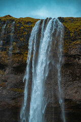 Kvernufoss a 30-meters high waterfall accessible via a rugged hiking trail in Iceland