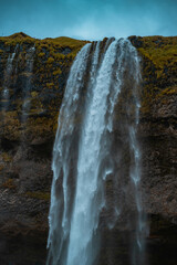 Kvernufoss a 30-meters high waterfall accessible via a rugged hiking trail in Iceland