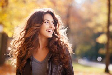 Fototapeta premium Young smile latin hispanic woman walking at park in autumn morning
