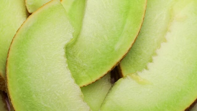 Pieces of melon, rotation in circle. slices of fresh ripe juicy melon Turning. selective focus. Seasonal fruit