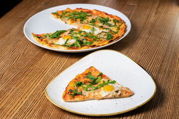 Pizza and slices with vegetables and herbs. Top view, flat lay and natural lighting