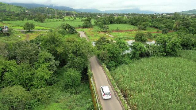 car going to pawana lake in greenry village in pune