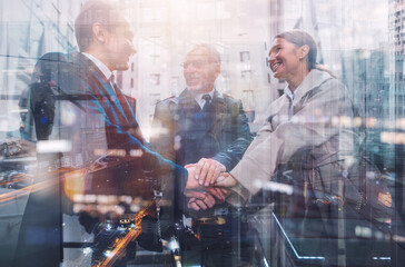 Business people putting their hands together as teamwork and partner