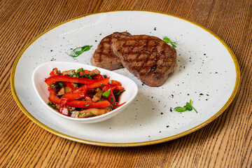 Meat breast, fillet, steak and fresh vegetable salad, top view, copy space. Healthy keto, ketogenic lunch menu with meat and organic veggies and greens.