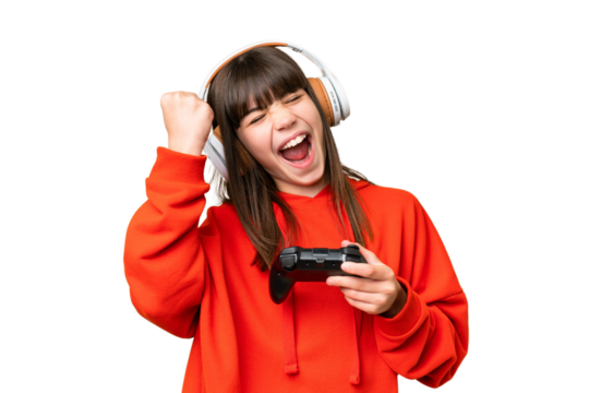 Little caucasian girl playing with a video game controller over isolated background celebrating a victory