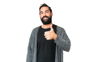 Young man with beard over isolated chroma key background giving a thumbs up gesture