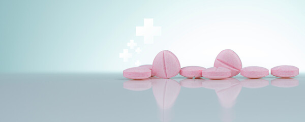Pink tablets pills on white background. Health and medical care concept. Pharmacy banner....