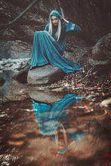 Winter queen. Autumn reflection in the water. Fantasy conceptual