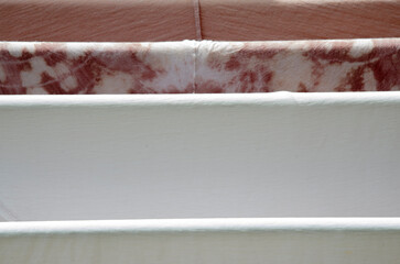 White and pattern of clothes dry on rack in sunlight